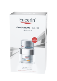 Weiß-silberne Eucerin Geschenkverpackung mit dem „Hyaluron-Filler + 3x Effect Straffendes Serum“ in einer Pipettenflasche und einer Tagespflege als Geschenk. Aufschrift: „Mildert Falten, strafft die Haut“ und „Medizinische Hautpflege“.