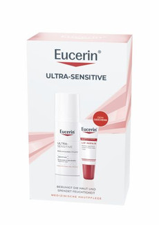Produktset in weißer Schachtel mit rosa Akzenten. Enthalten sind die Eucerin „Ultra-Sensitive Beruhigende Pflege“ im Pumpspender und die „Lip Repair“ Lippenpflege als Geschenk. Text: „Beruhigt die Haut und spendet Feuchtigkeit“.