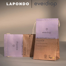 Nachhaltiges everdrop Bodenreiniger-Pulver in Papierverpackung, platziert unterhalb der Logos von LAPONDO und everdrop.
