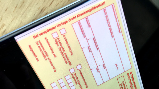 AU-Schein auf dem Handy