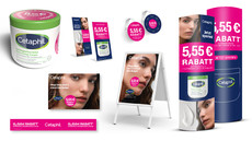 Tiegel Cetaphil Feuchtigkeitscreme mit Aufkleber zur 5,55 Euro Rabattaktion und Promotionpaket, bestehend aus Aufsteller, Schaufensteraufkleber, Poster sowie Regalstörer und -Schiene