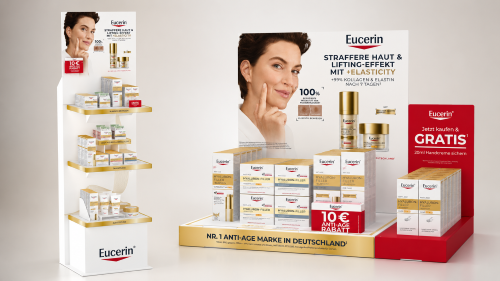 Weißer Eucerin-Verkaufsaufsteller mit drei Regalböden für Hautpflegeprodukte und Eucerin-Tischaufsteller mit Produkten, Rabattaktion und Gratis-Handcreme. 